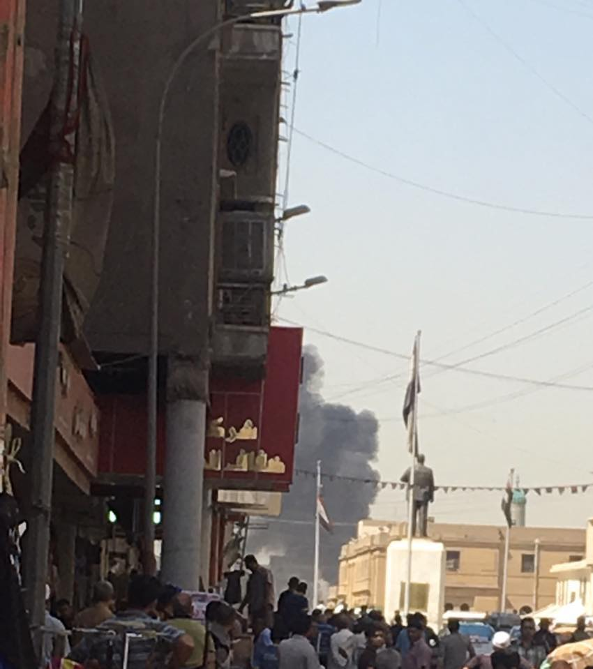 Photo posted on social media showing a black smoke rising from the site of the explosion in Baghdad, Iraq, May 30, 2017.